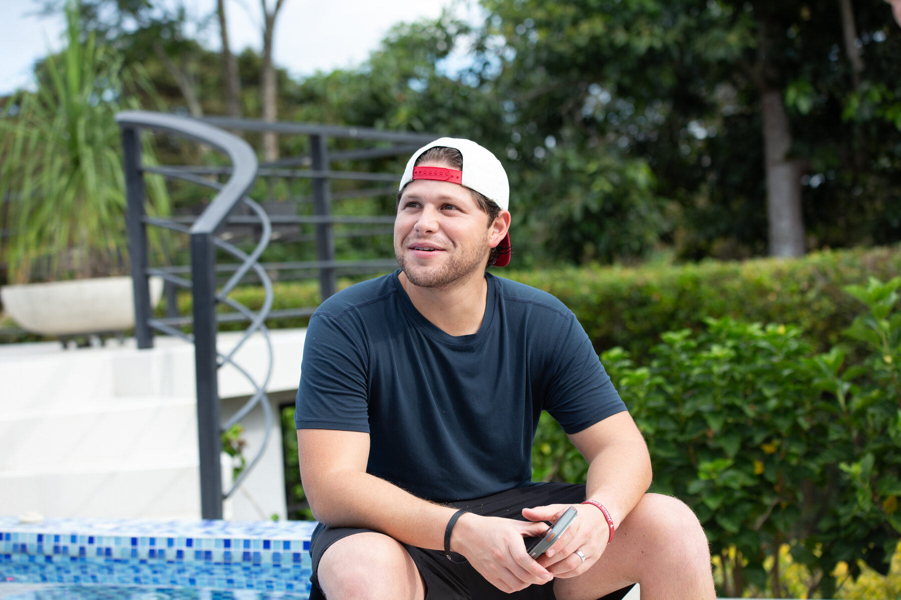 Camilo, a member of the World Mobile community, sitting outdoors and talking to camera