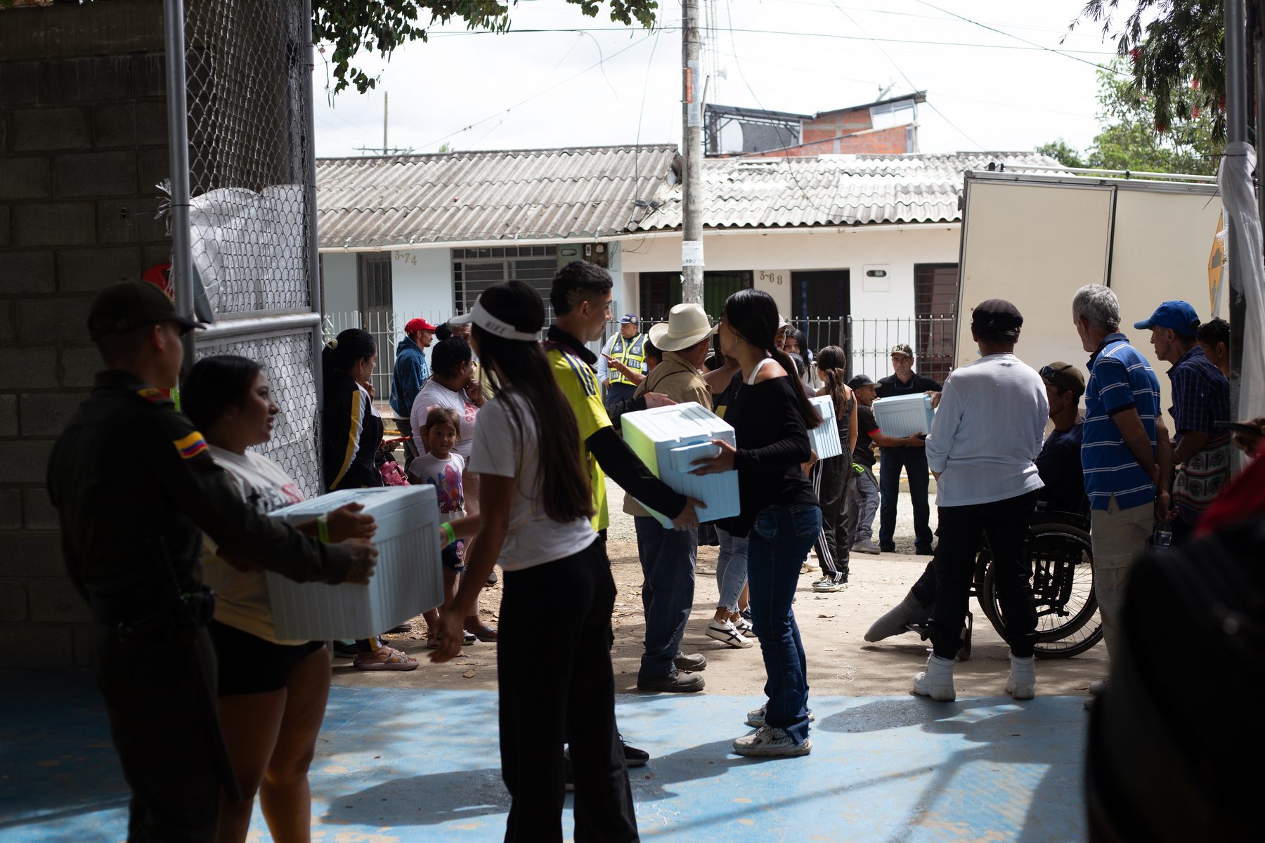 Emergency shelters and aid distribution on a covered sports centre